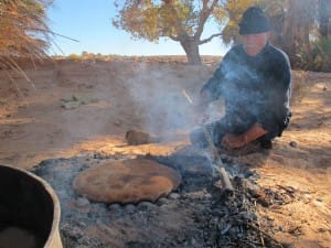 Berber man cooking Berber pizza Saf Saf Oasis Morocco_Source NOSADE