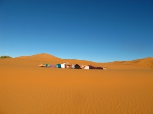 Desert yoga cobra pose Sahara desert Morocco_Source NOSADE.jpg