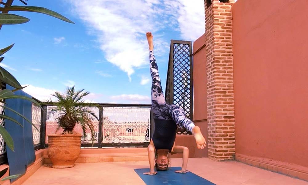 Headstand Rooftop Marrakech_Source Amanda LaMagna Livaligned