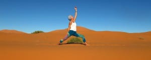 Sahara desert yoga Morocco Urdvha Virabhadrasana 2_Source NOSADE