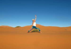 Sahara desert yoga Morocco Urdvha Virabhadrasana 2_Source NOSADE