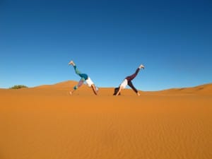 Sahara desert yoga retreat Morocco Erg Chebbi Eka Pada Adho Muka Svanasana_Source NOSADE