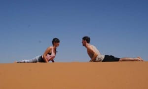 Yoga in the desert Cobra pose_Source NOSADE
